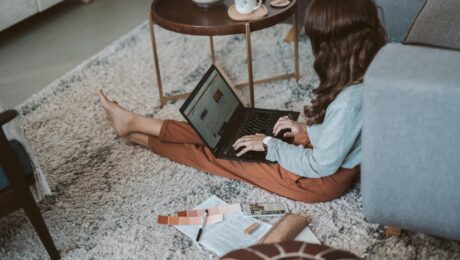 carpet colors. image of girl sitting on carpet with color swatches.