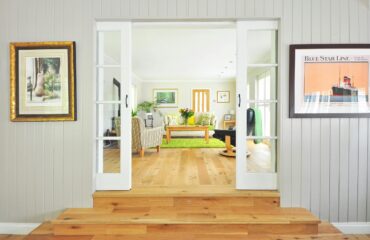 living area flooring living area flooring. image of a double doorway that leads into living room with wood flooring.